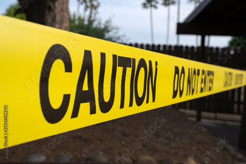 Photography Close Up Warning Tape With Restricted Access Notice showing a closed area and wa
