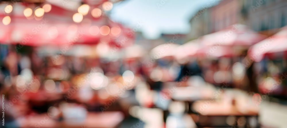 Fototapeta premium bokeh market scene with red and ivory wood textures