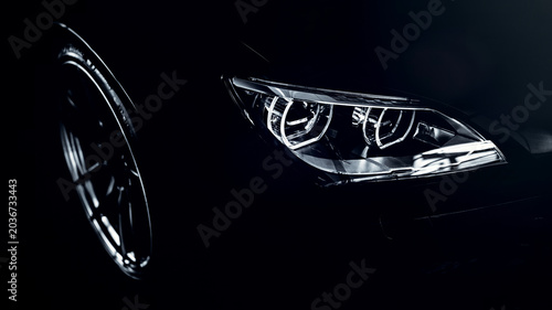 Obraz na plátne Modern sports car headlight detailing on dark background