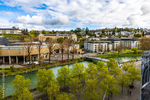 фотографія Gave de Pau river at the foot of the Sanctuary of Our Lady of Lourdes with the f