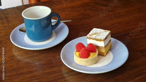 Sweet pastries and hot coffee serving on plates for a delightful afternoon tea moment
