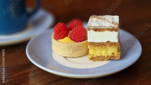 Pastries on a plate with coffee creating a sweet snack experience