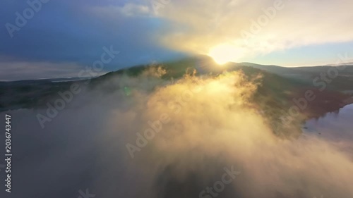 FPV Drone Bursting Through Clouds Into Brilliant Sunrise
