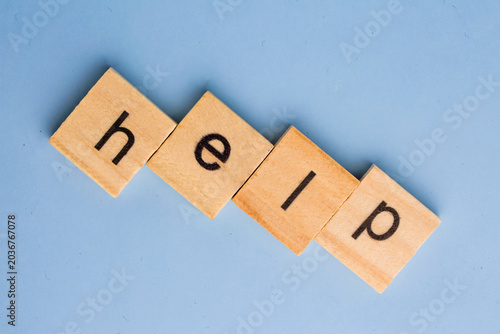cubes with word help on a blue background