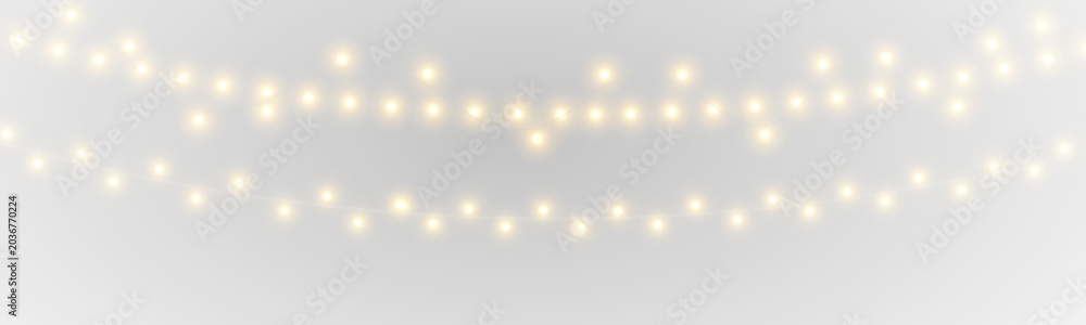 Fototapeta premium Elegant golden fairy lights with luminous bulbs and twinkling sparkles bring warmth to festive compositions. PNG transparent background ensures easy integration.