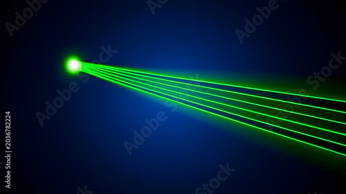 Bright green laser beam cutting through dark space, creating striking visual effect
