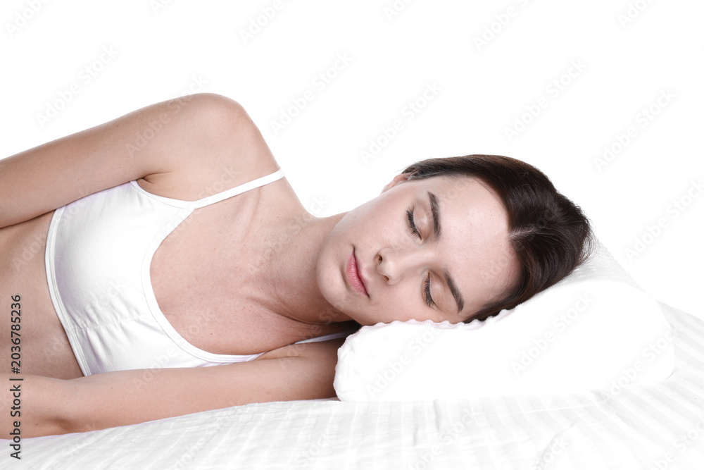Obraz premium Woman sleeping on bed with orthopedic pillow against white background