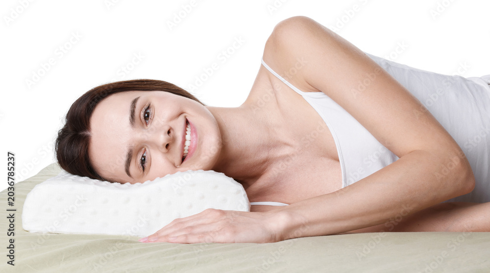 Fototapeta premium Woman lying on bed with orthopedic pillow against white background