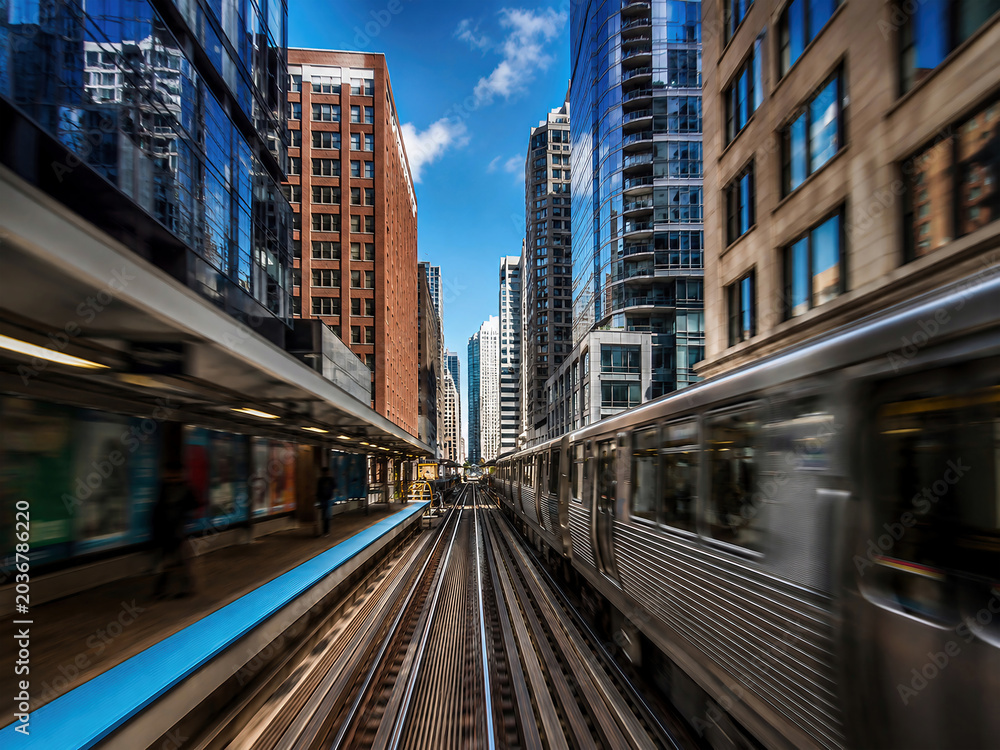 Fototapeta premium Motion blur of CTA L train on tracks in downtown Chicago loop
