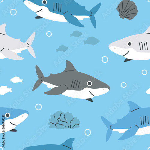 vector seamless shark pattern with smiling sharks, bubbles and coral on blue background. Childish ocean vector illustration for nursery, fabric, wallpaper and textile design.