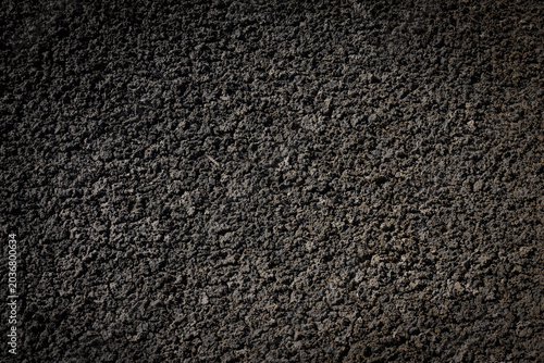 Schilderij op canvas Texture de roche volcanique noire, symbole des forces naturelles de la Terre