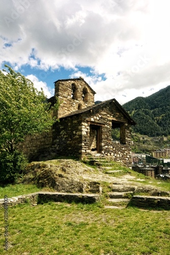 Tablou pe pânză The historic Church of Sant Roma de les Bons made of stone masonry with a bell g