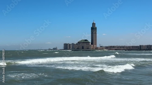 Hassan II Mosque rising above Atlantic Ocean waves in Casablanca Morocco