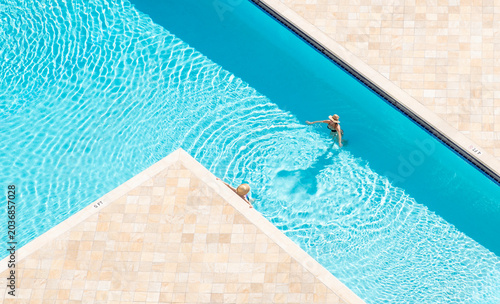 aerial drone woman people pool relaxing miami florida