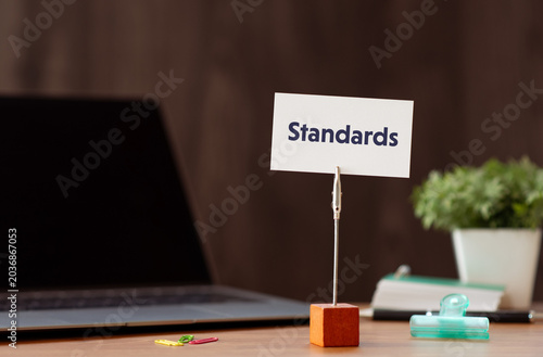 Tableau sur toile Corporate and management concept of Standards represented on card with laptop, clips