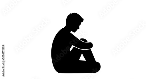 Photos Silhouette of a person sitting on the ground, knees pulled up to the chest, conveying a sense of sadness or contemplation