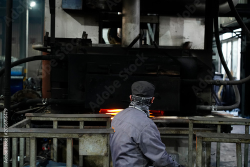 Worker Operating in Metal Forging/Heat Treatment Workshop