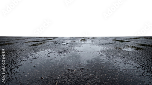 Wet road surface with central water trail on black background