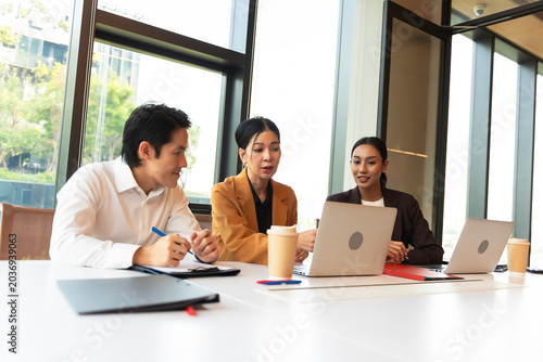 Group colleagues in office having casual discussion during meeting in conference room.teamwork concepts.