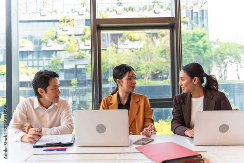 Group colleagues in office having casual discussion during meeting in conference room.teamwork concepts.