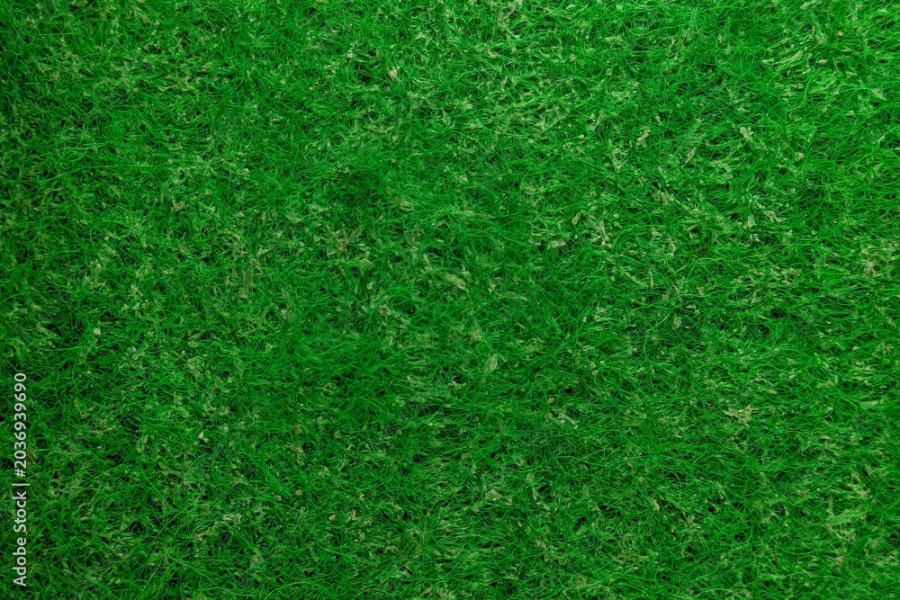 Fototapeta premium Bright green synthetic fiber texture background close up macro shot.