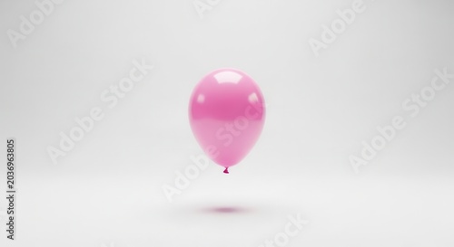A single pink balloon floating in the air against a plain white background.