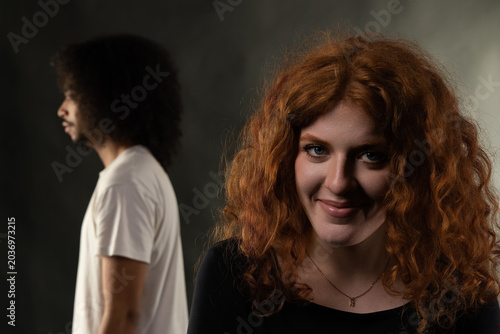 Photos Woman and man standing back to back, representing relationship challenges in stu