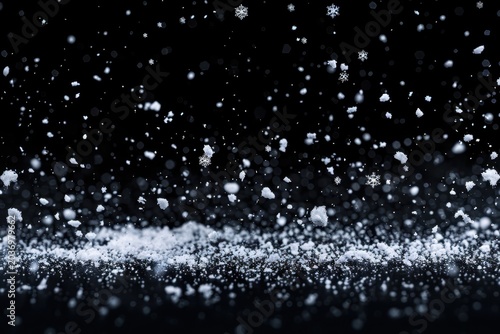 Magical snowfall creating a serene winter scene with gentle flakes in dark ambiance.