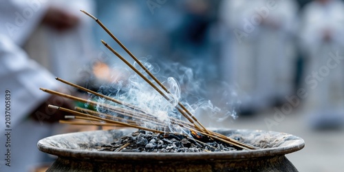 Burning incense sticks release calming aromatic smoke