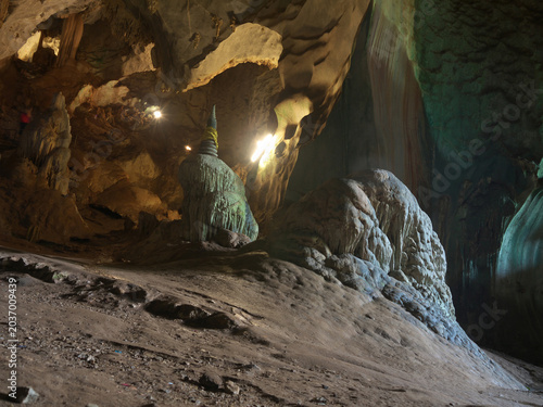 Photos Buddhist chedi spire on top of a massive natural stalagmite formation inside the