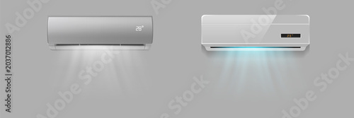 Tableau sur toile Two wall-mounted air conditioners on a gray background, operating in cooling mode