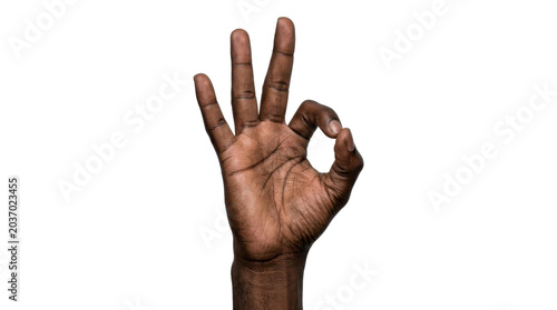 Black hand showing okay gesture on a transparent background PNG image