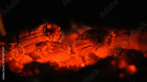 Glowing Embers in a Dark Fireplace.