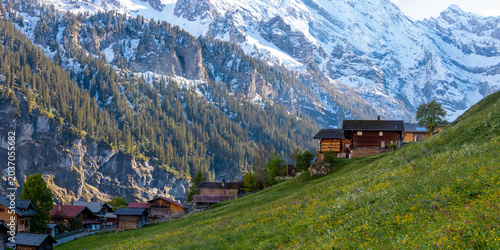 Canvas-taulu Swiss Alps village Gimmelwald with traditional chalets and snow capped mountains