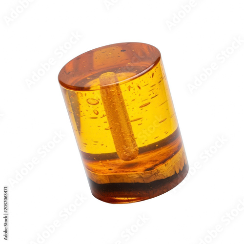 Amber resin with trapped air bubbles and plant fragment