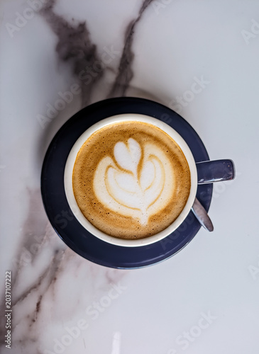 Cappuccino with latte art photographed from above