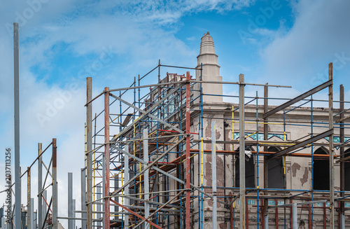 historical building restoration. Construction work. Scaffolding erected around the construction site and safety measures taken.	
