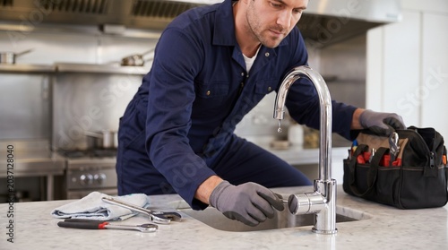 Dripping Tap Home Repair Scene Showing Detailed Chrome Fixtures Skilled Worker Activity, Commercial Maintenance Composition