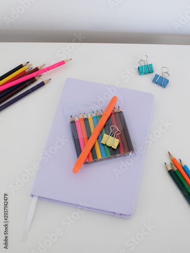 Pastel notebook with mini colored pencils and stationery accessories