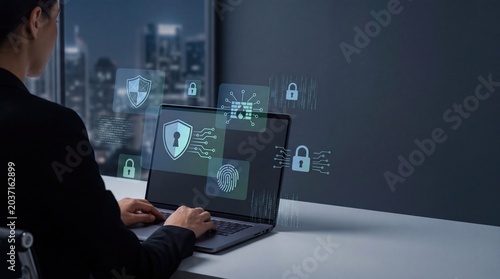 Businesswoman working on laptop with holographic cybersecurity icons, shield, lock and firewall floating in modern office at night, data protection concept