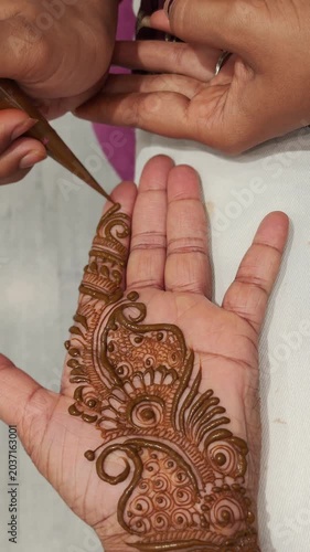 henna painting on hands