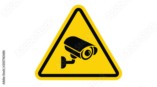 Black security camera icon centered inside a bright yellow triangular hazard sign isolated on a clean white background for modern surveillance and safety warning graphic design