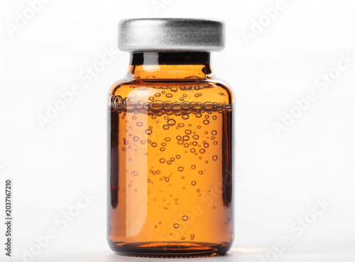 Pharmaceutical amber glass bottle with silver cap isolated on transparent background