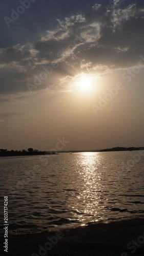 Vertical sunset reflection over calm lake water video