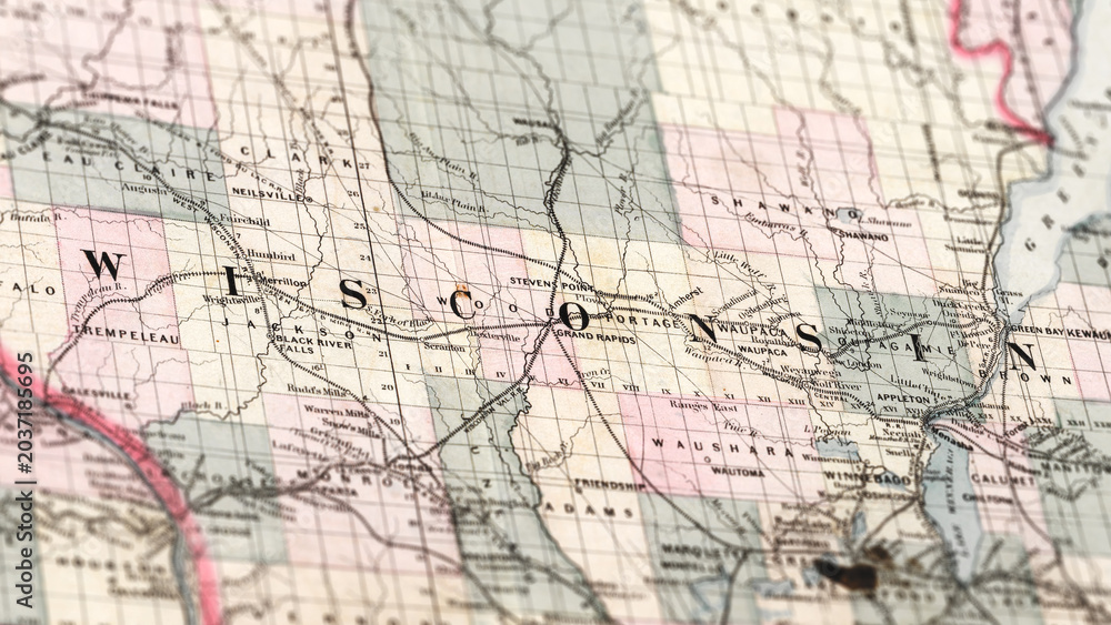 Fototapeta premium Macro View of Vintage Map Highlighting Wisconsin USA with Detailed Geographic Cartography.