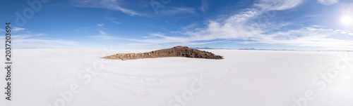 A rocky island in an endless white salt desert