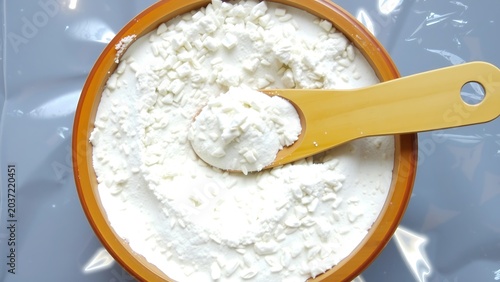 A Wooden Bowl Rice Or Wheat Flour A Flour-Coated Spoon
