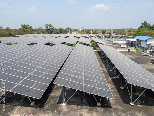 Aerial View of Commercial Rooftop Solar Panel Array at Industrial Facility