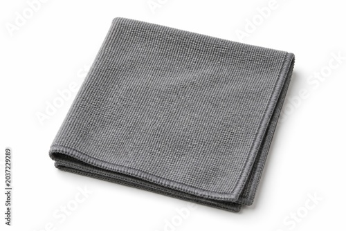 Gray microfiber cleaning cloth folded neatly, showcasing its textured surface and potential for household tasks.
