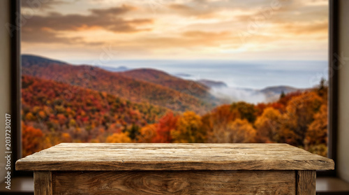 Wooden table mockup with autumn mountain valley landscape background
